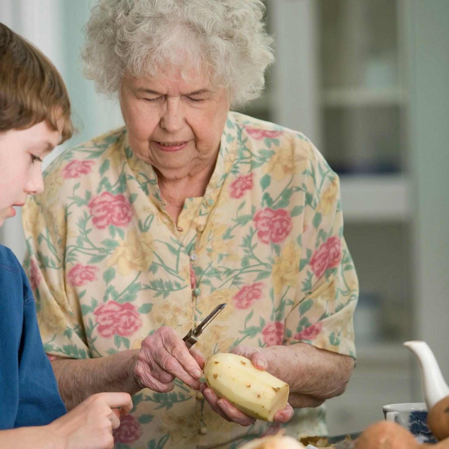 Community members collaborating in a contemporary kitchen, sharing recipes and techniques